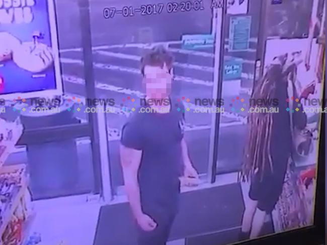Sharon Hacker at the cash register pays for milk while Ben Rimmer turns around as the woman approaches, axe in her hand and a knife in her back pocket. Picture: news.com.au