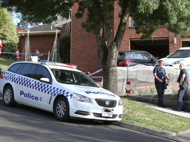 Police out the front of the house this morning. Picture: David Crosling