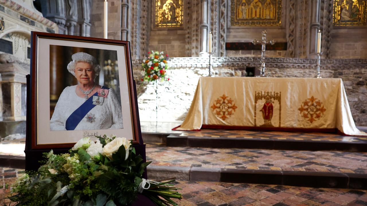 Flowers placed by Britain's Prince William and Princess Catherine next to a portrait of the late Queen Elizabeth at St Davids Cathedral. Picture: Getty.