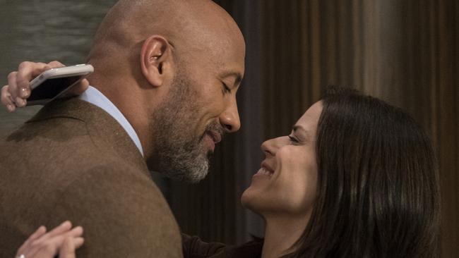 Dwayne Johnson and Neve Campbell in a scene from film Skyscraper