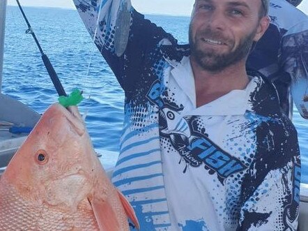 Mark Pace with a fish caught on a Disney Ooshie toy.