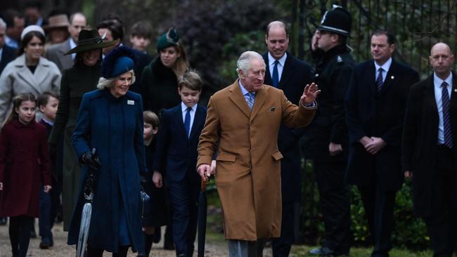 Britain's King Charles III with Camilla, Queen Consort waves to members of the public as he arrives for the Royal Family's traditional Christmas Day service at St Mary Magdalene Church in Sandringham, Norfolk, eastern England, on December 25, 2022. Picture: AFP