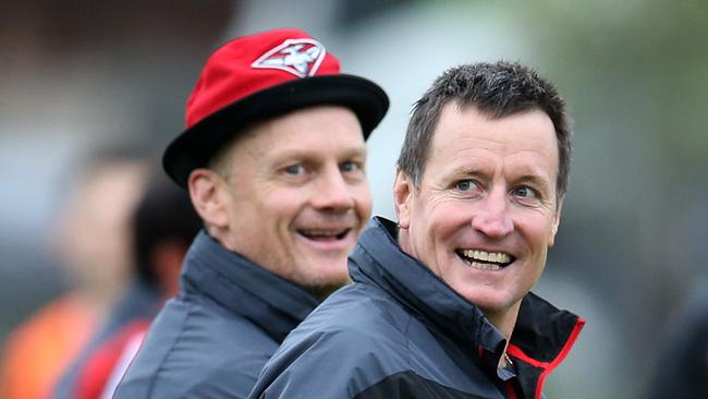Guy McKenna (L) will join Cricket Victoria in a coaching capacity after 30 years in the AFL.