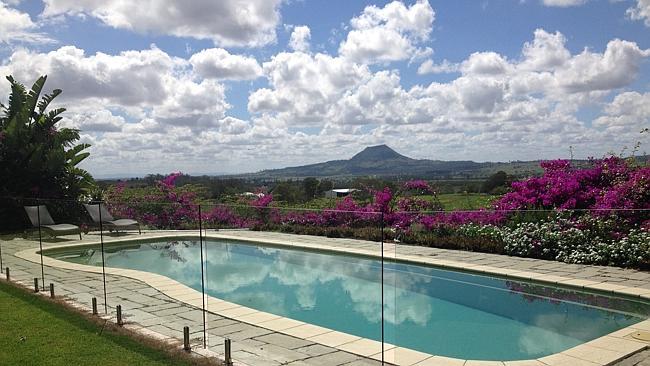 On one side is a tropical paradise; on the other, a colourful garden with breathtaking mountain views.