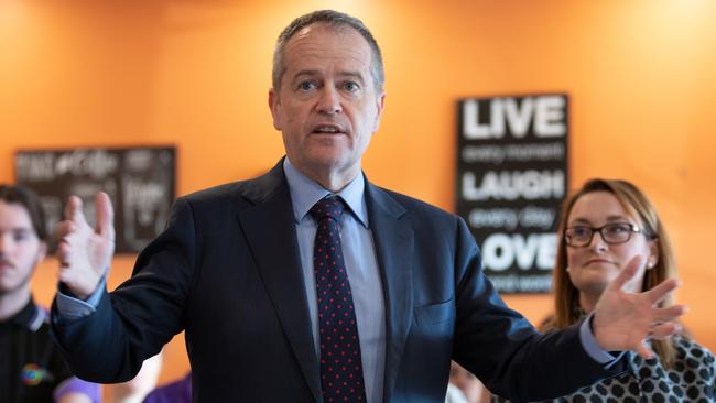 Opposition Leader Bill Shorten (centre) is seen visiting the Meercroft Aged Care Home with the Labor candidate for Braddon Justine Keay (right) in Devonport, Tasmania, Tuesday, July 10, 2018. (AAP Image/Grant Wells) NO ARCHIVING