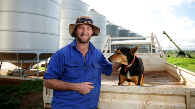 Farmer Dan Fox with his dog Batman on his farm in Marrar. Picture: Jonathan Ng