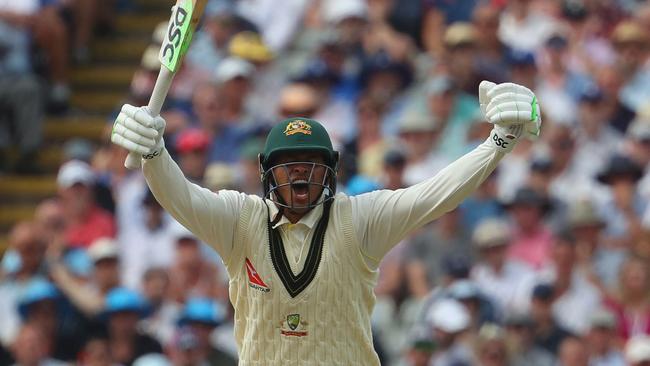 Australia's Usman Khawaja celebrates after reaching his century during play on day two of the first Ashes cricket Test match between England and Australia. Picture: AFP