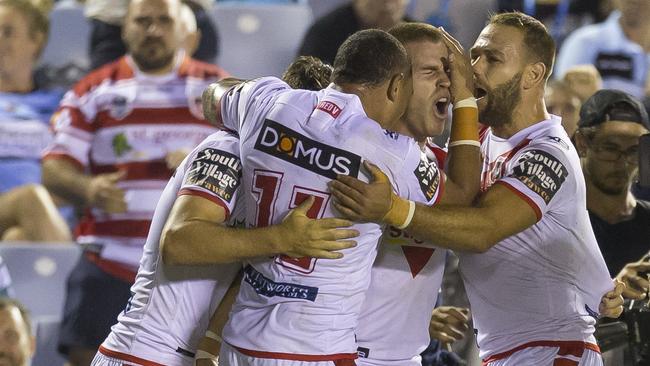 Euan Aitken and the Dragons celebrate a try during their Round 2 win over Cronulla.