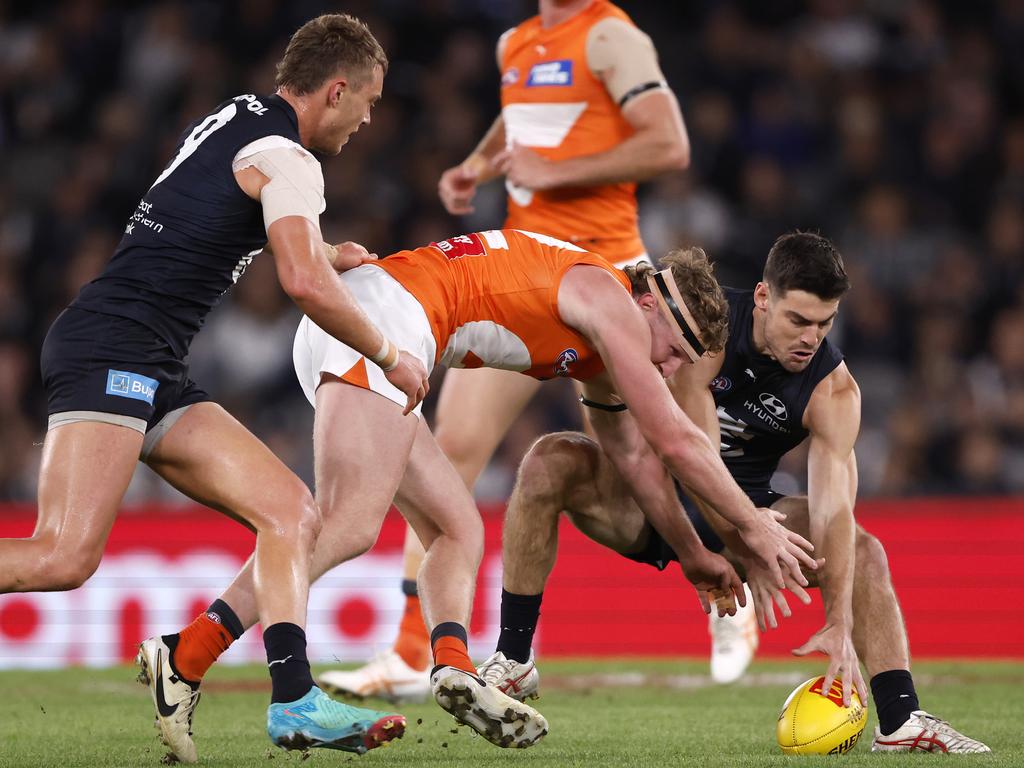 MELBOURNE, AUSTRALIA - APRIL 20:  Tom Green of the Giants competes with George Hewett of the Blues during the round six AFL match between Carlton Blues and Greater Western Sydney Giants at Marvel Stadium, on April 20, 2024, in Melbourne, Australia. (Photo by Darrian Traynor/Getty Images)