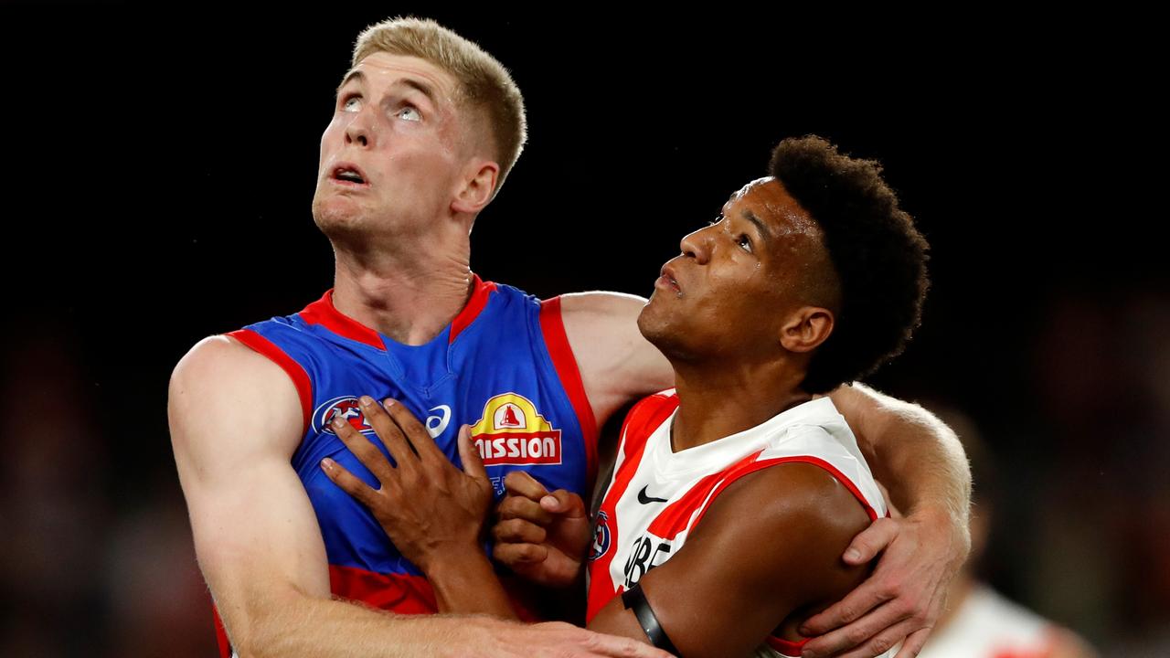 MELBOURNE, AUSTRALIA - MARCH 31: Tim English of the Bulldogs and Joel Amartey of the Swans compete for the ball during the 2022 AFL Round 03 match between the Western Bulldogs and the Sydney Swans at Marvel Stadium on March 31, 2022 In Melbourne, Australia. (Photo by Dylan Burns/AFL Photos via Getty Images)