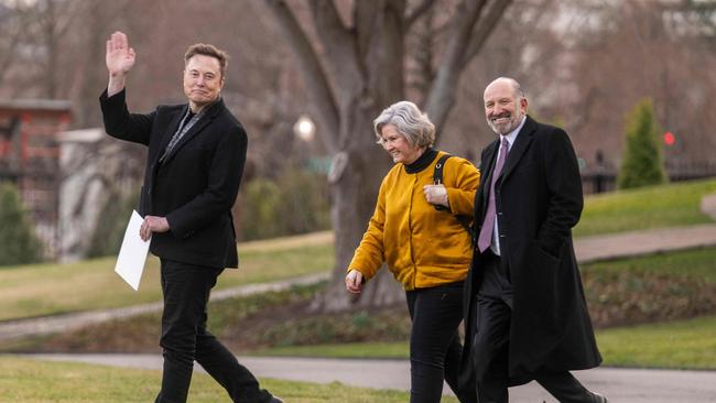 Elon Musk (L) waves as he walks with Howard Lutnick (R) and White House Chief of Staff Susie Wiles (C). Picture: AFP