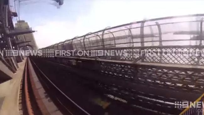 Channel 9 video still of "train surfing" on the Sydney Harbour Bridge"