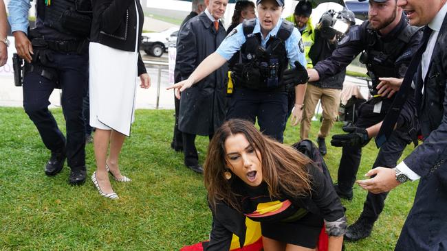 She broke away from police by crawling on her knees. Picture: AAP Image/Michelle Haywood