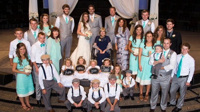 The Duggar family at Jill and Derick Dillard’s 2014 wedding. Picture: TLC