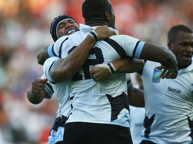 NANTES, FRANCE - SEPTEMBER 29: Fiji players celebrate their team's 38-34 victory as the final whistle blows during the Rugby World Cup 2007 Pool B match between Wales and Fiji at the Stade de la Beaujoire on September 29, 2007 in Nantes, France. (Photo by Shaun Botterill/Getty Images)