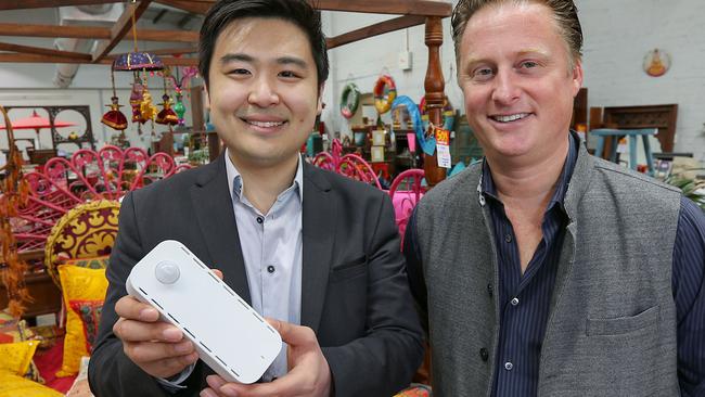 David Mah has invented a smartphone size device that can track the movements of shoppers around a store, giving all sorts of insights into who is walking past, coming in, how long they are staying and what they are looking at. The store Ishka is using it. David Mah and Ishka owner Toby Darvall are pictured with the device in the Nicholson Street Ishka store in Fitzroy.Picture:Ian Currie