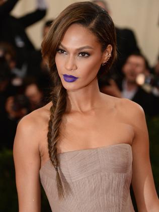 Model Joan Smalls rocks purple lips. Picture: Getty