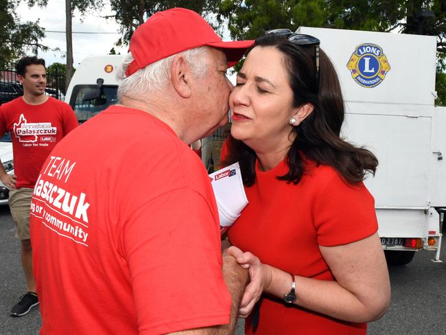 Premier Annastacia Palaszczuk kisses her father Henry, a Labor stalwart, as she arrives to cast her vote at Inala State School yesterday. Picture: Dan Peled/AAP