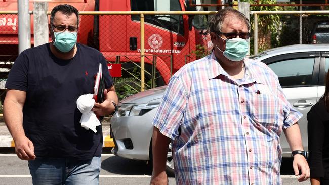 Andrew Neophitou, friend of the late Australian cricket player Shane Warne, and a friend of Warne's arrive at Bophut police station on Thailand's Koh Samui. Picture: AFP