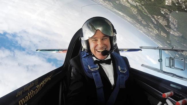 Matt Hall back in his stunt pilot days over Lake Macquarie. Pic: Sam Ruttyn