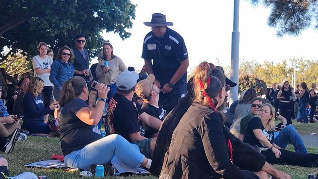 A security guard allegedly telling concert-goers they would have to move if they wished to sit on blankets at the Pandemonium event at the Broadwater Parklands on Saturday April 27. Picture: Dale DAFF / Facebook