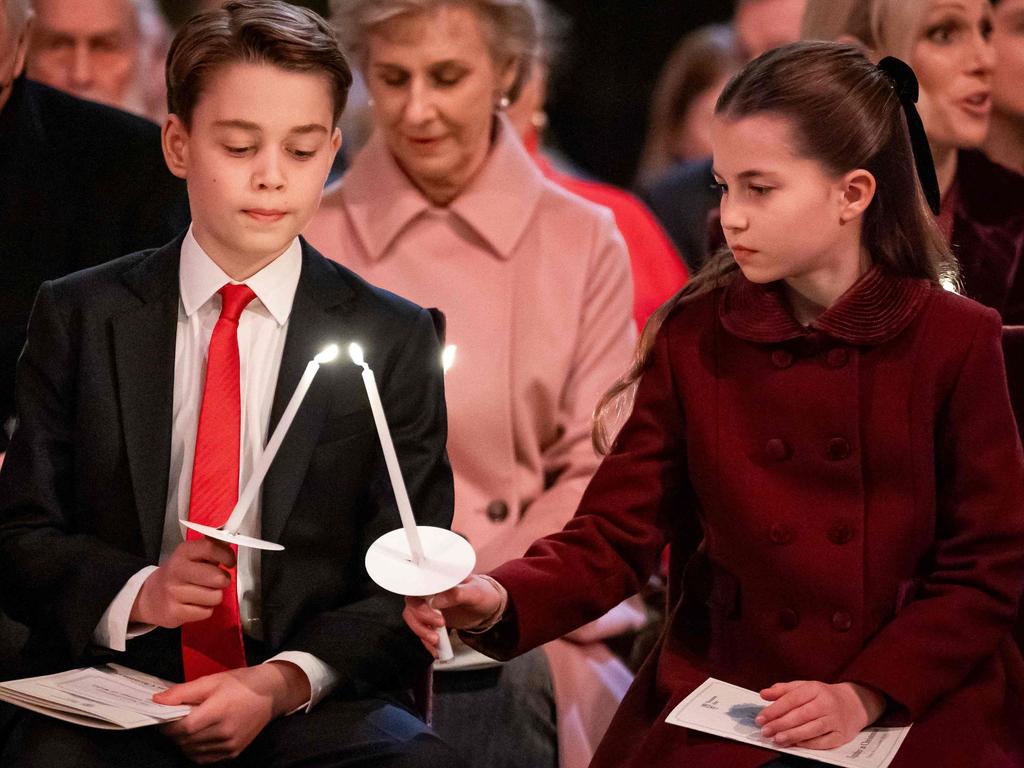 Prince George of Wales (L) and Princess Charlotte of Wales attend the "Together At Christmas" Carol Service" at Westminster Abbey in London. Picture: AFP