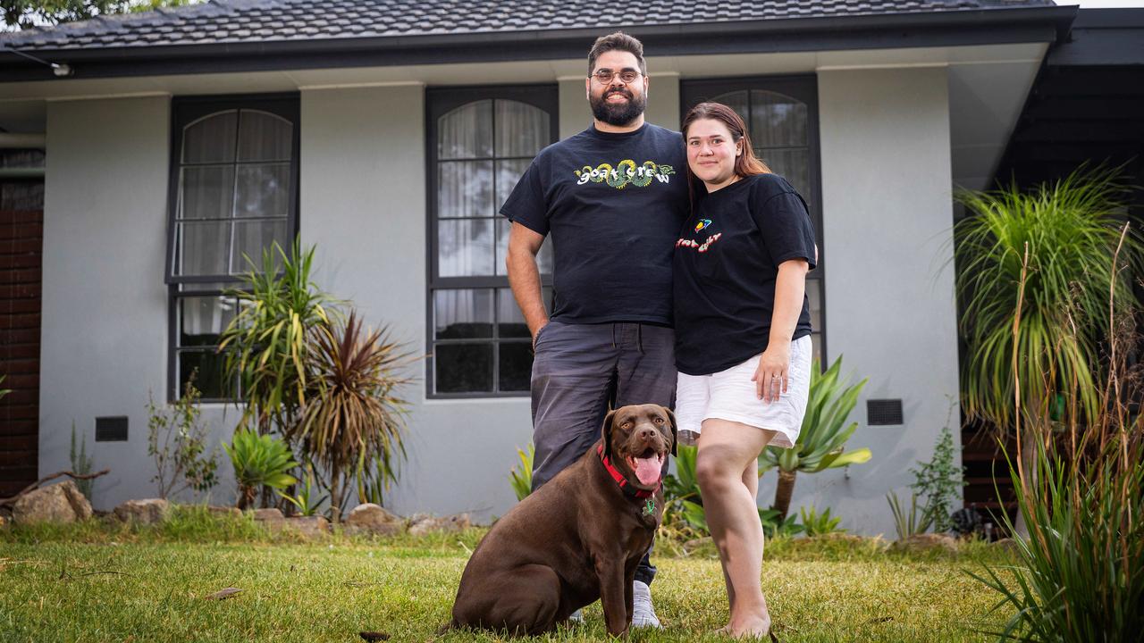 Jesse and Tiana, pictured with their dog Tobé, have bought a home and are planning to get married next year. Picture: Mark Stewart.