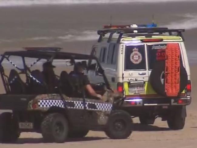 Emergency services on the beach in Broadbeach after a Hungarian tourist was pulled from the water. Picture: Nine News.