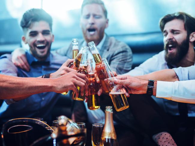 Group of men toasting with beer