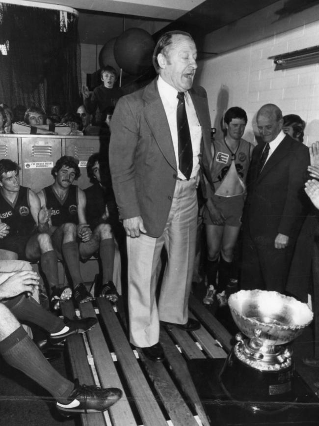 Sturt coach Jack Oatey in the Norwood rooms congratulating them on their premiership win.