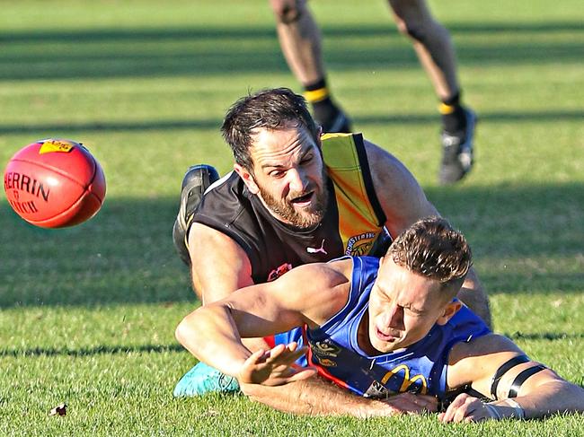 Goulburn Valley Football League season 2019. Round 11, June 22 at Seymour. Rochester 11.6 (72) d Seymour 6.11 (47). Rochester playing coach James Flaherty applies a big tackle on Seymour's Harrison Wade. Picture: AARON COOK