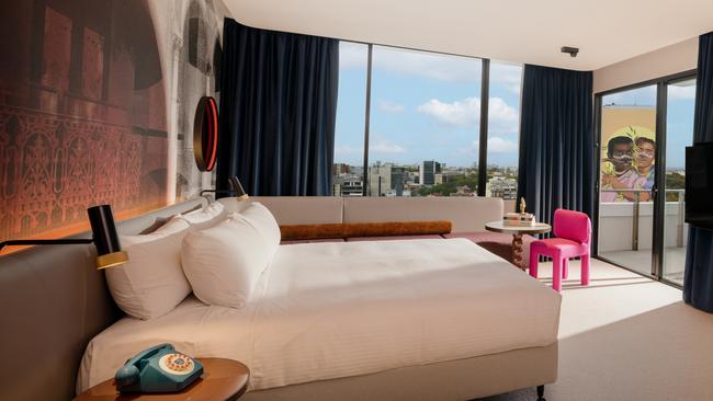 Guestroom with balcony overlooking the surrounds.