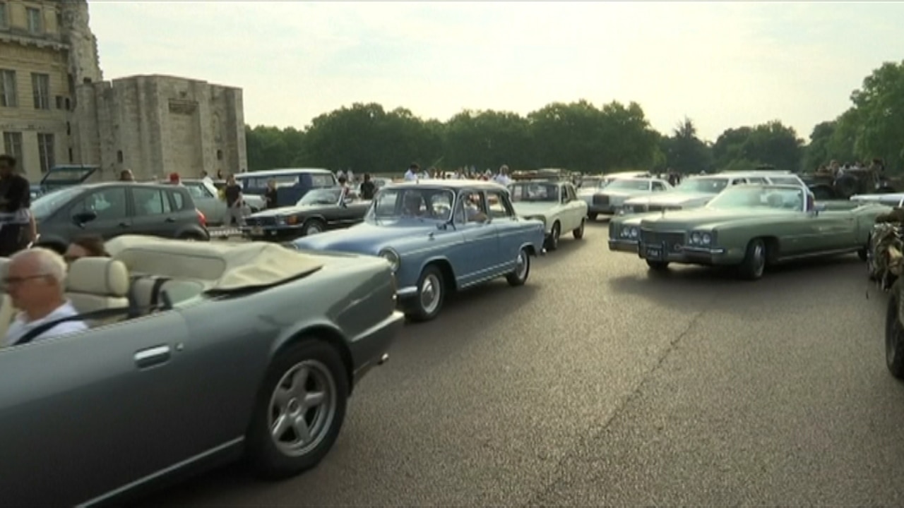 Retro vehicles parade around Paris