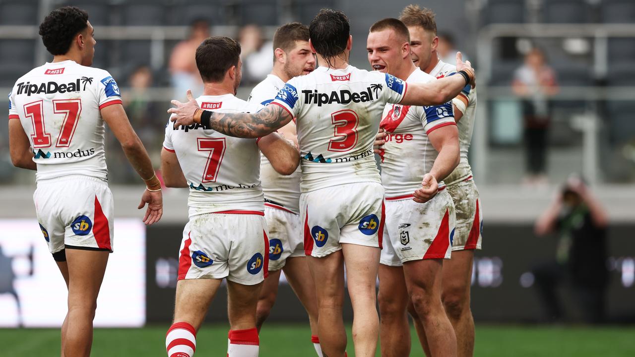 SYDNEY, AUSTRALIA - AUGUST 28: Jackson Ford of the Dragons celebrates with teammates after scoring a try during the round 24 NRL match between the Wests Tigers and the St George Illawarra Dragons at CommBank Stadium, on August 28, 2022, in Sydney, Australia. (Photo by Matt King/Getty Images)