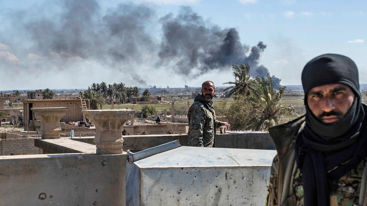 Kurdish-led forces and US warplanes rain artillery fire and air strikes on outgunned jihadists making a desperate last stand in a Syrian village. Picture: Delil Souleiman/AFP