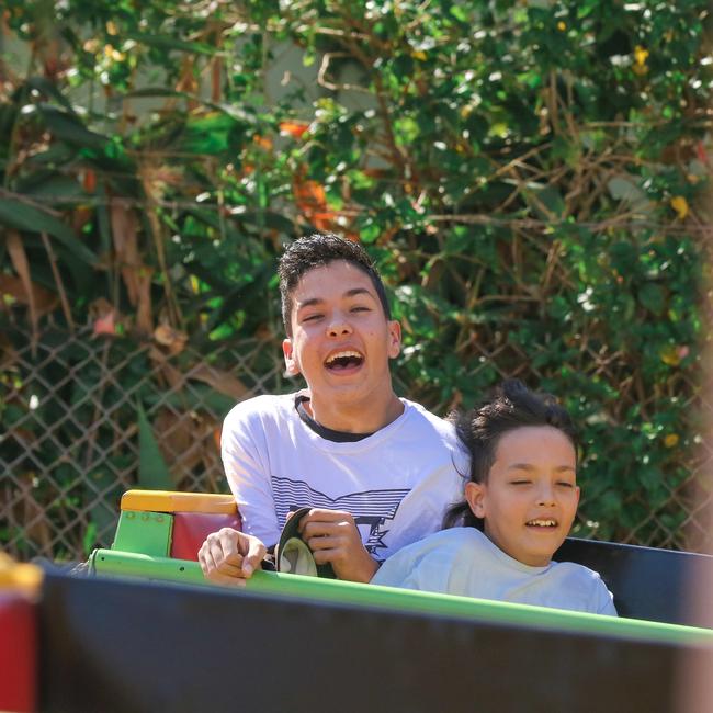 Lachlin Petri, 13, and brother Kaiden, 11, enjoying the third and final day of the Royal Darwin Show. Picture: Glenn Campbell