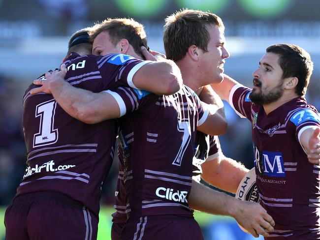 Jake Trbojevic (2nd right) of the Sea Eagles is congratulated by Daly Cherry-Evans, Cameron Cullen (right) and Tom Trbojevic (left) after scoring try during the round 19 NRL match between the Manly Sea Eagles and the West Tigers at Lottoland in Sydney on Sunday, July 16, 2017. (AAP Image/Paul Miller) NO ARCHIVING, EDITORIAL USE ONLY