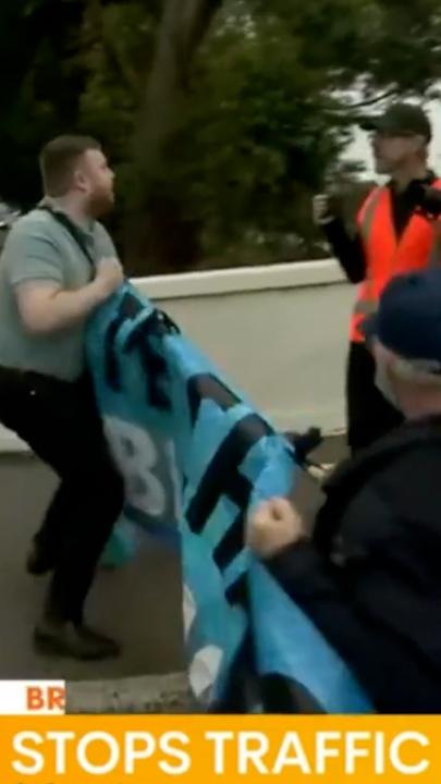 Banner ripped from climate protester on Punt Road 