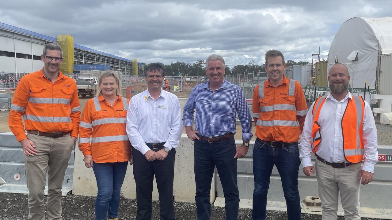 Manufacturing Minister Dale Last and Maryborough MP John Barounis talk to members of Downer at the Torbanlea train manufacturing factory, set to be complete in late 2026.