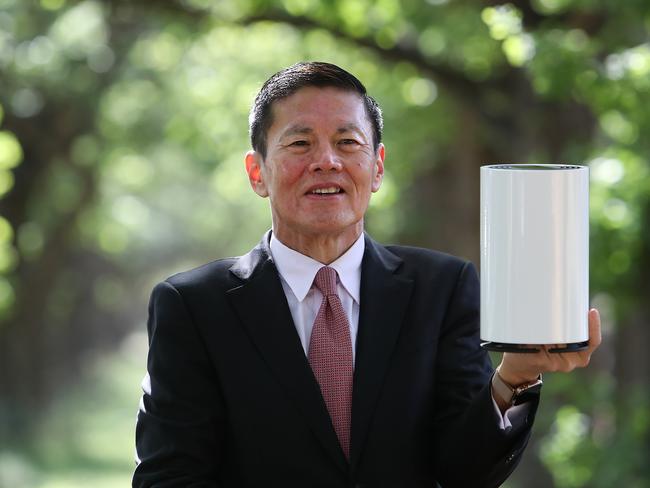 Optus CEO, Allen Lew in Canberra. holding the Nokia 5G broadband device.