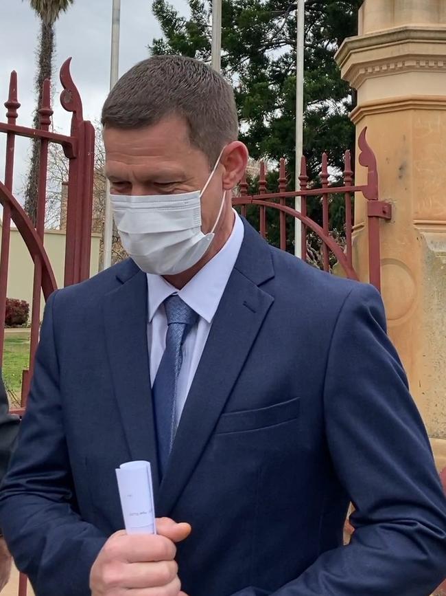 Dubbo domestic violence offender Jason Elliot leaves court after being sentenced.