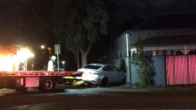 Tim Smith’s boomer car lodged in the fence of a house in Power Street, Hawthorn. Picture: Olivia and Charlotte Neish.