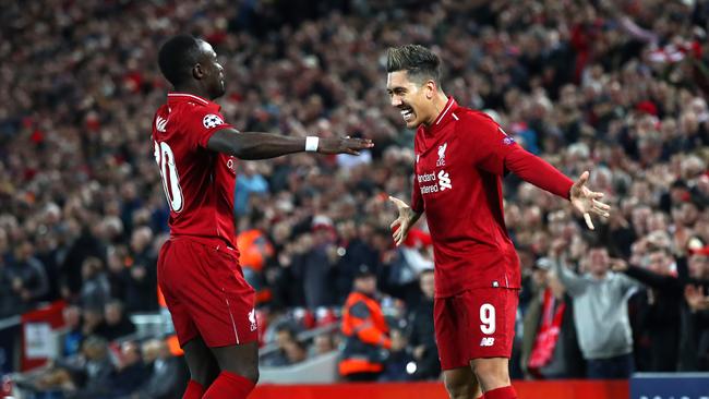 LIVERPOOL, ENGLAND - APRIL 09: Roberto Firmino of Liverpool celebrates after scoring his team's second goal with Sadio Mane of Liverpool during the UEFA Champions League Quarter Final first leg match between Liverpool and Porto at Anfield on April 09, 2019 in Liverpool, England. (Photo by Julian Finney/Getty Images)