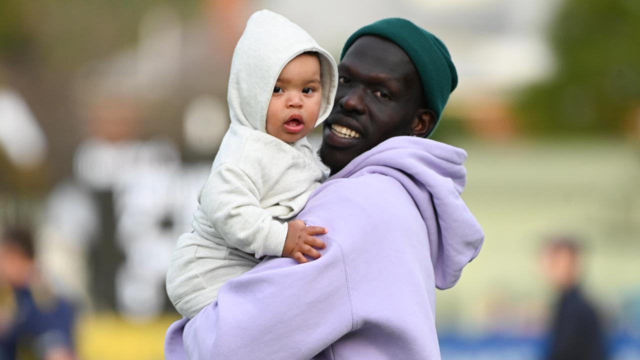 Aliir Aliir with his son, Mayom. Picture: Naomi Jellicoe