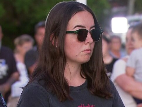 Survivor Constable Keely Brough honouring the victims of the attack at a candlelight vigil service in the nearby town of Chinchilla. Picture Seven News