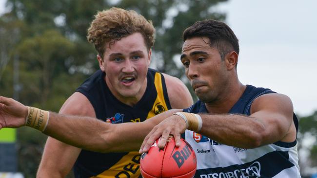 ]South's Malcolm Karpany is chased by Glenelg’s Will Gould during Saturday’s incredible draw.  Picture: AAP/Brenton Edwards