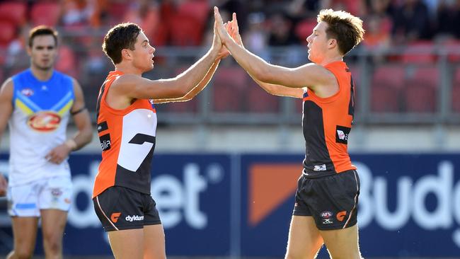 Josh Kelly and Toby Greene celebrate a goal for the Giants last year.