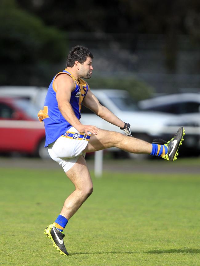 Marc Holt kicks his 100th goal in 2013.