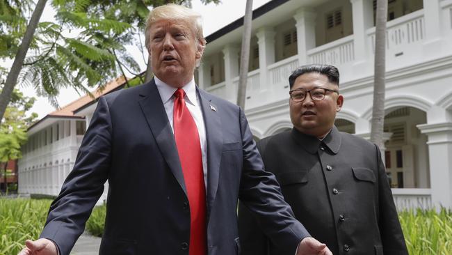 Donald Trump and Kim Jong-un leave their first meeting.  Picture: AFP