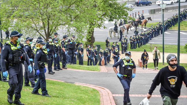 Police formed a ring around the group. Picture: Jake Nowakowski